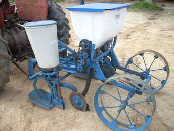The model 309 is not able to be converted for use with the lustran plates. . Ford 309 planter parts for sale